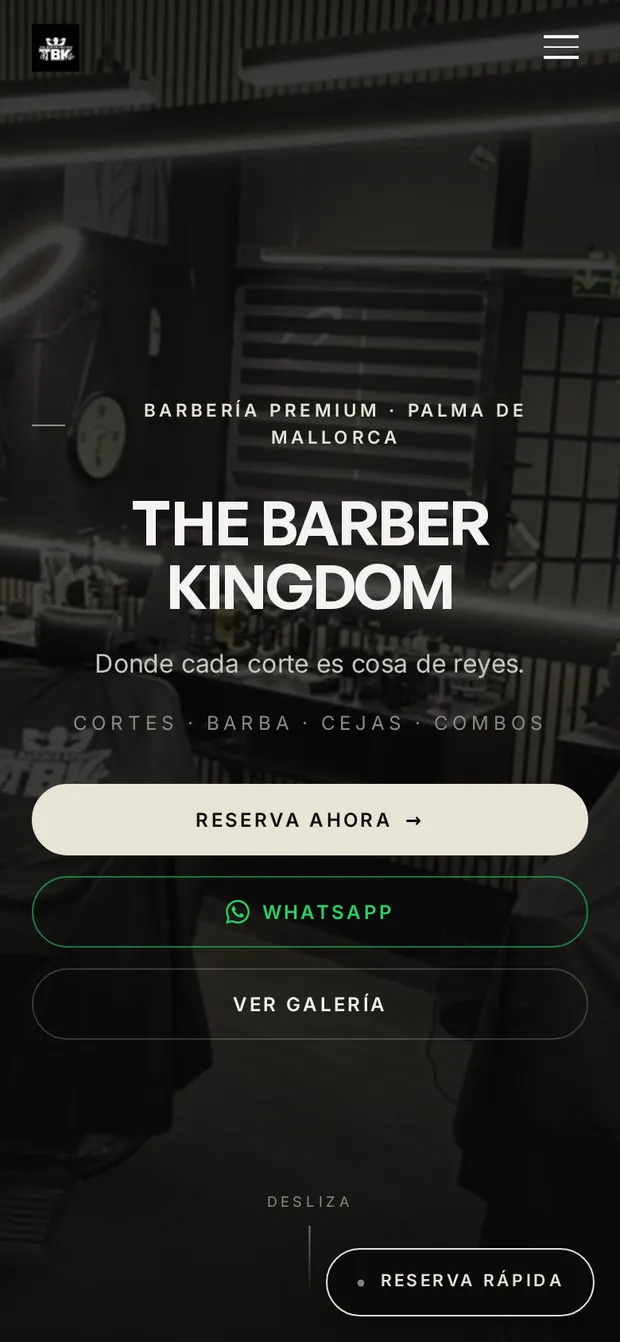 The Barber Kingdom homepage on a phone, with the shop's name over a photograph of the barber chairs and buttons to book, write on WhatsApp and see the gallery.